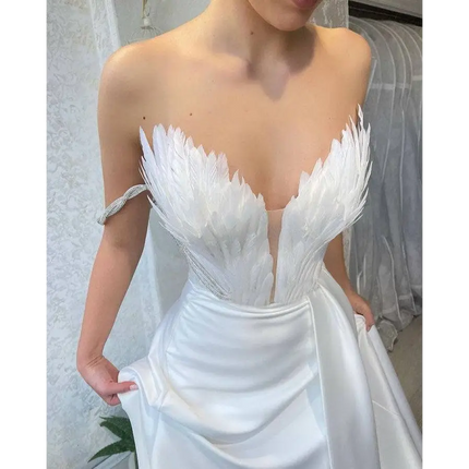 White Satin Gown with Feathers Sweeping the Floor