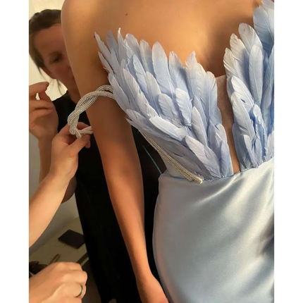White Satin Gown with Feathers Sweeping the Floor